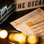 Oscars 2025 movie checklist and ballot on table.