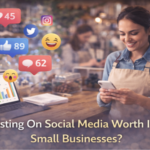 Person in cafe using smartphone with social media icons.