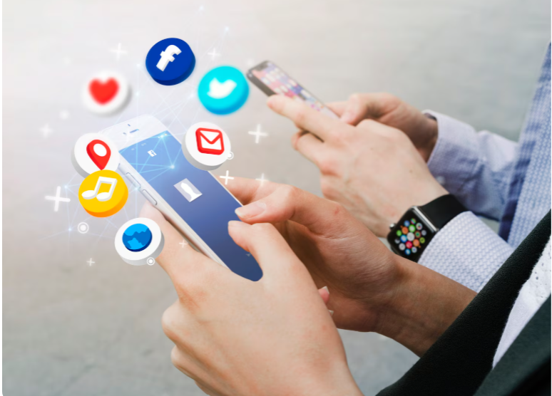 People using smartphones with social media icons floating.