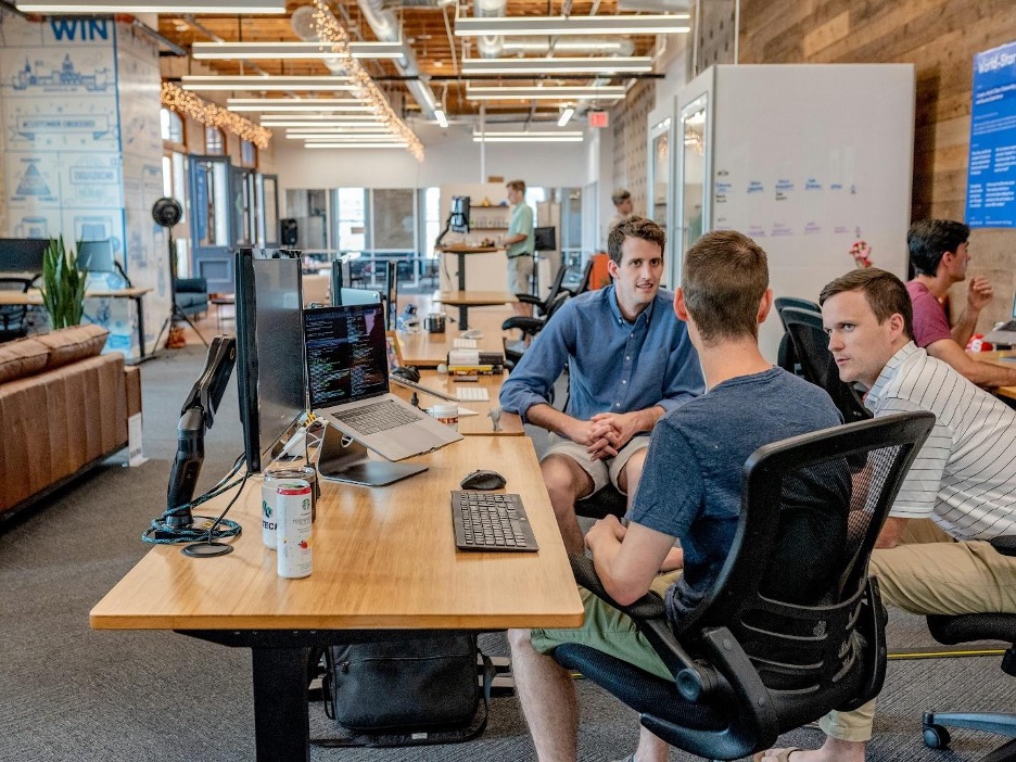 Team collaborating in modern office environment.